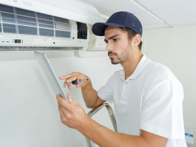 Contractor Servicing a Heat Pump